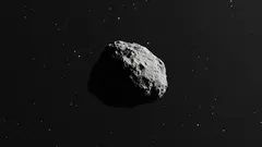 Asteroid letící vesmírem, tmavé pozadí s hvězdami, detailní textura povrchu.