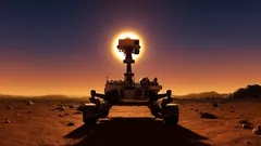 Mars rover na rudé planetě při západu slunce, silueta a sluneční záře v pozadí